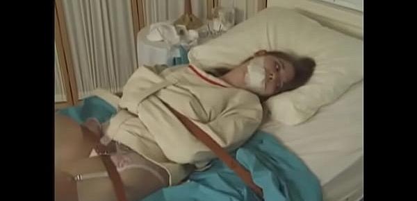  Pretty brunette in Straitjacket taped mouth forced tied to bed hospital